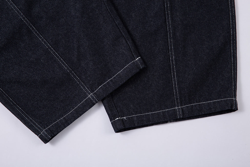 Scimitar-cut raw denim – Blue