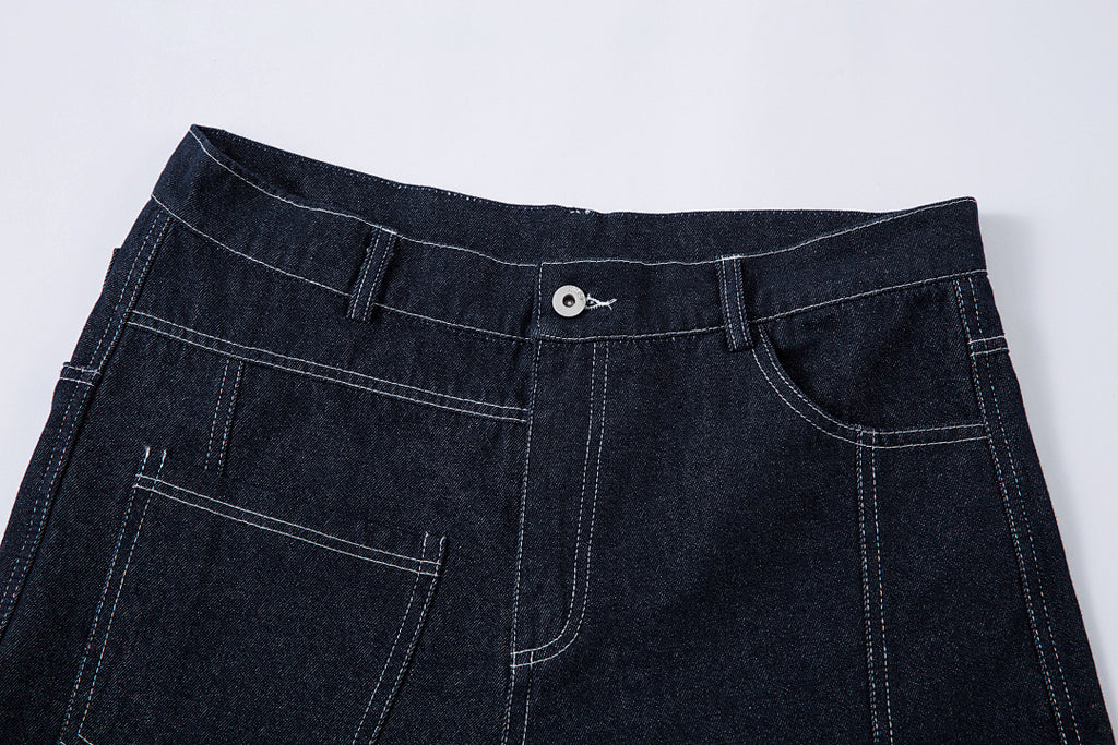 Scimitar-cut raw denim – Blue