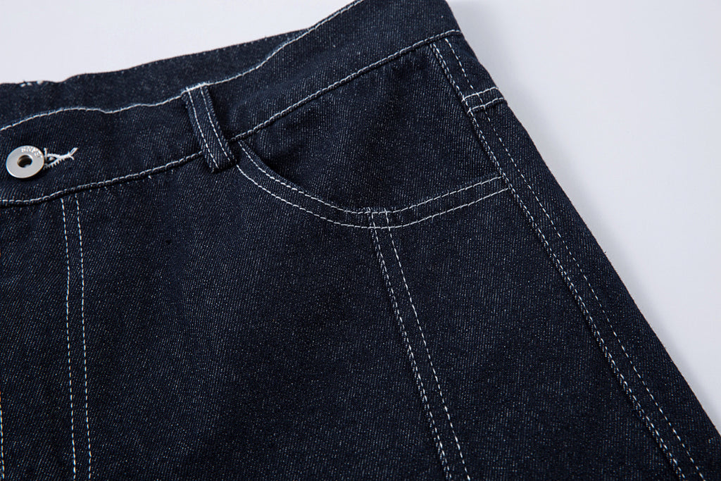 Scimitar-cut raw denim – Blue
