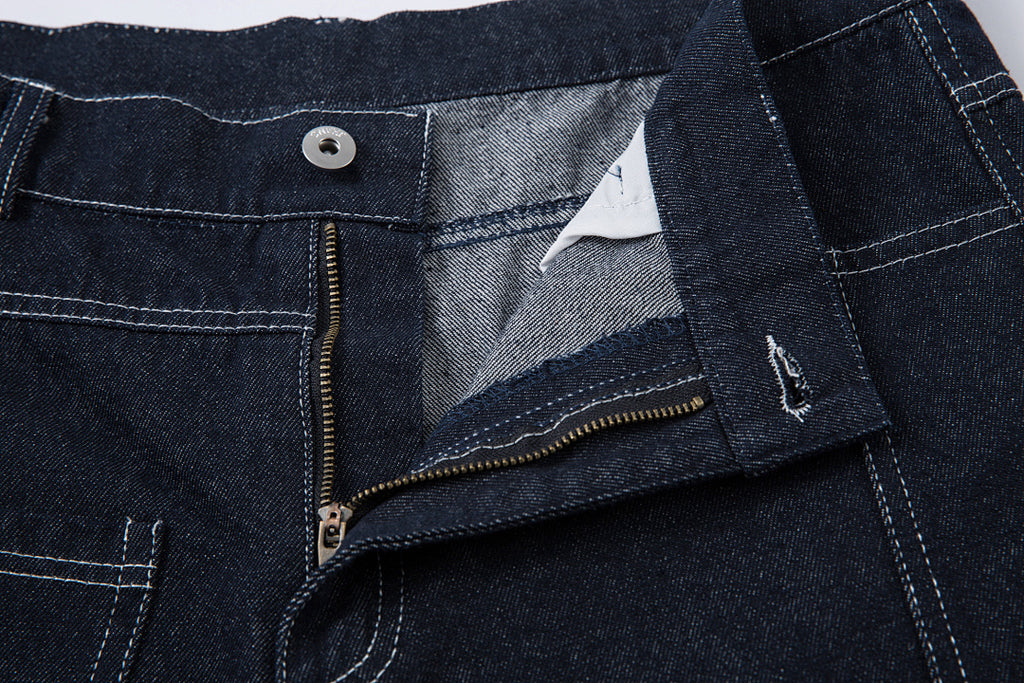 Scimitar-cut raw denim – Blue